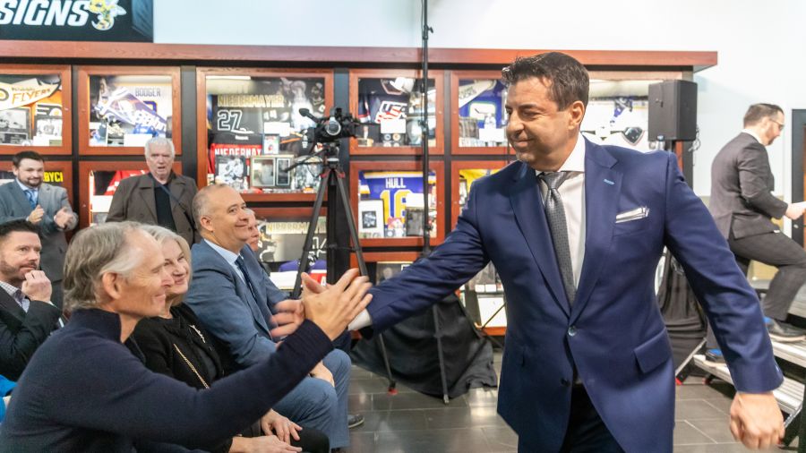 <who>Photo credit: NowMedia/Gord Goble</who> Vees owner Graham Fraser greets coach/GM Fred Harbinson after stint at the mic