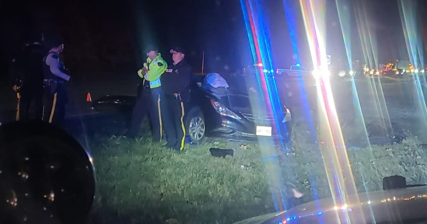 <who> Photo Credit: BCHP </who> RCMP investigators at the scene of the fatal collision.