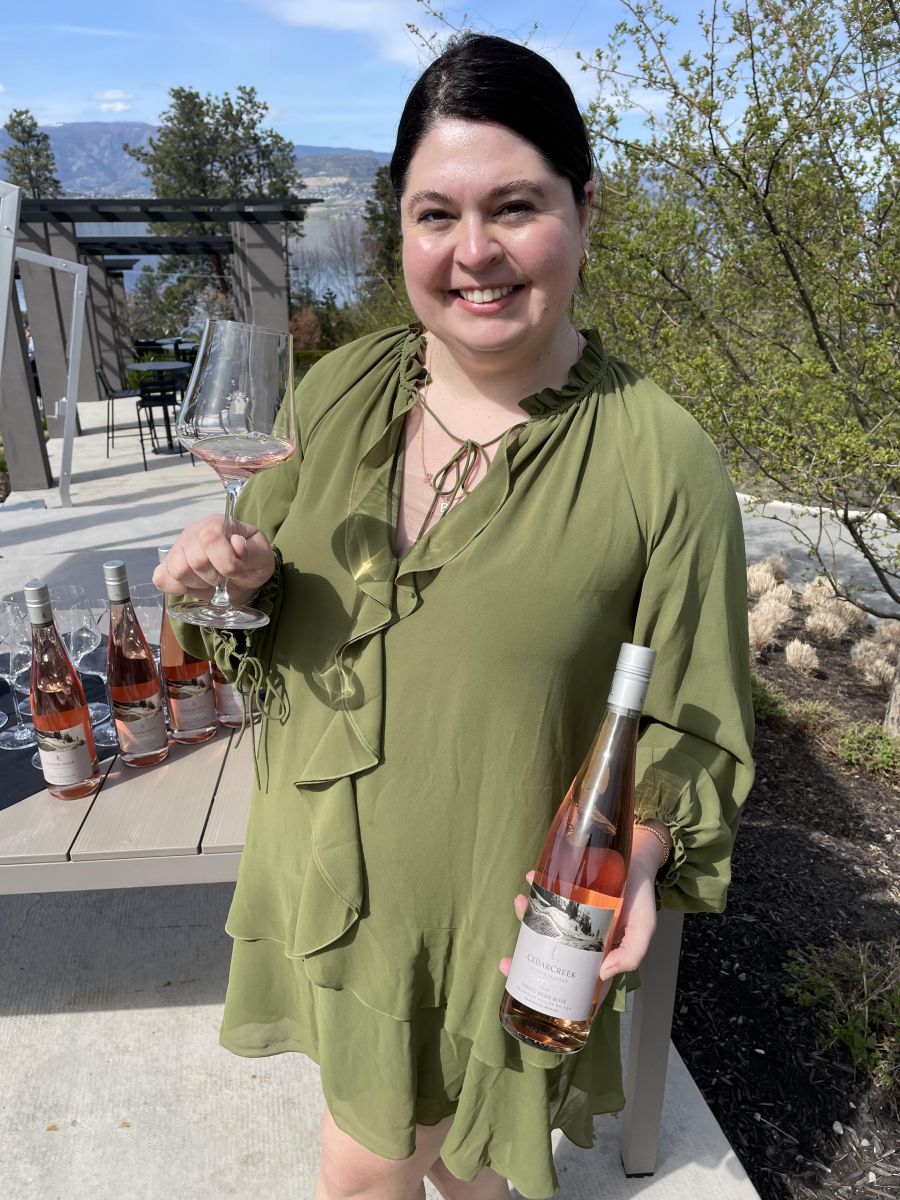 <who>Photo credit: Steve MacNaull/NowMedia Group</who>CedarCreek Estate Winery guest services manager Brynne Dickson with the 2023 Platinum Naramata Pinot Noir Rose ($42).