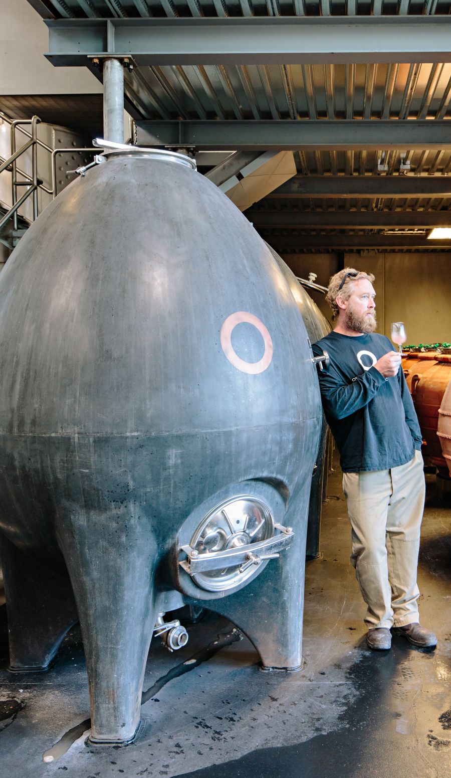 <who>Photo credit: Jon Adrian</who>Haywire winemaker Matt Dumayne with one of the winery's 40 concrete vessels.