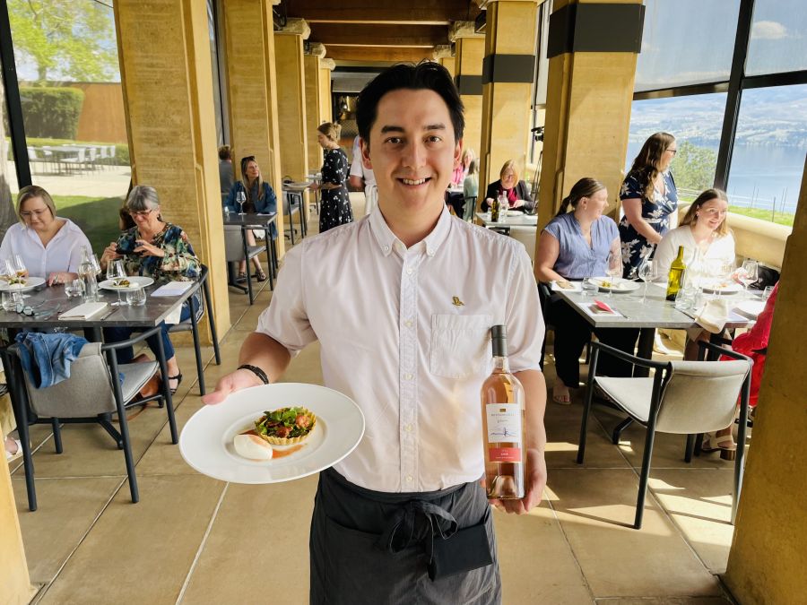 </who>Server Joe Watson with the asparagus and tomato tart and 2024 Reserve Rose ($26) at Mission Hill's Terrace restaurant.
