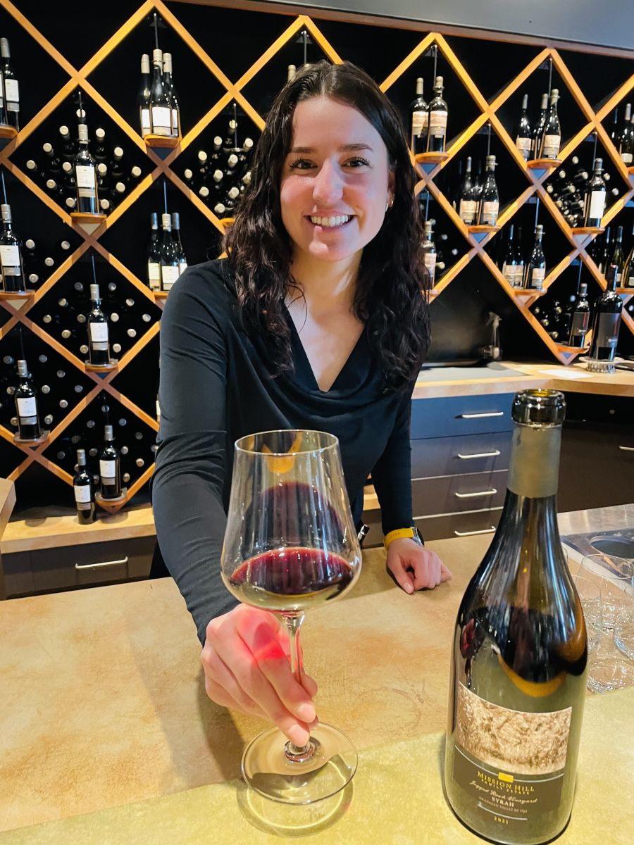 </who>Guest experience supervisor Sofia Berardi serves up the 2021 Jagged Rock Terroir Collection Syrah ($62) at the tasting bar.