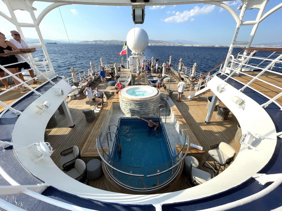 <who>Photo credit: Steve MacNaull/NowMedia Group</who>The back, top deck of the Wind Star, above, has a pool, hot tub, bar and lounging areas. Below, the Wind Star at sail.