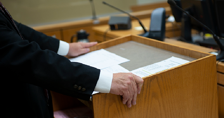 <who> Photo credit: Cliff MacArthur </who> A stock image showing a court scene.