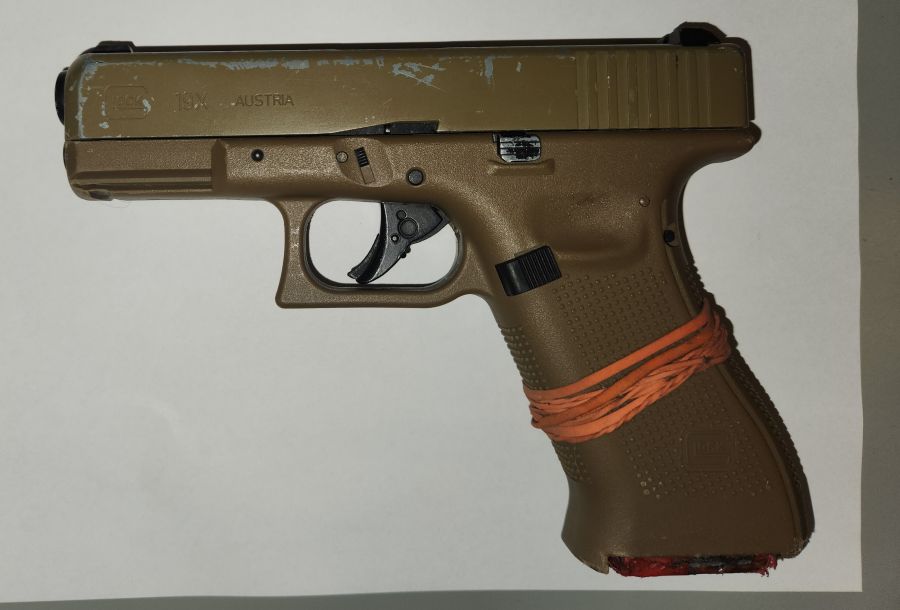 <who>Photo Credit: Chilliwack RCMP</who>The replica Glock 19X handgun seized from the 17-year-old suspect.