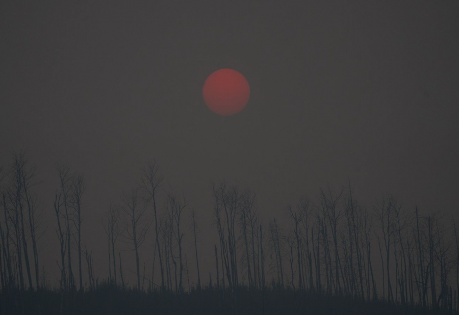 <who> Photo credit: Canadian Press </who> Smoke from wildfires is visible in Fort McMurray, Alberta, on Saturday, Sept. 2, 2023.