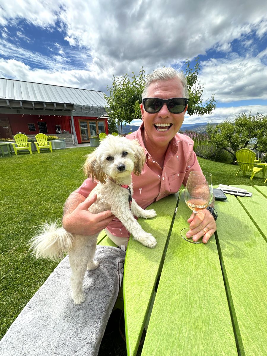 <who>Photo credit: Kerry MacNaull</who>Wine columnist Steve MacNaull and his pup, Daisy, enjoy a glass of Rose at Joie Farm Winery.