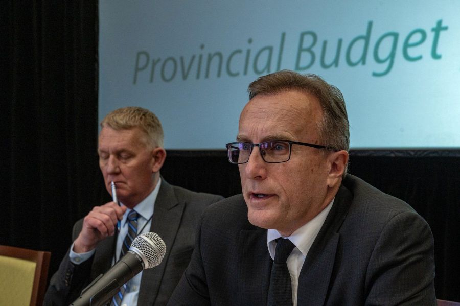 <who>Photo Credit: Canadian Press</who>Saskatchewan Finance Minister Jim Reiter, right, speaks to members of the media, with deputy finance minister Max Hendricks, prior to the release Saskatchewan Provincial Budget in Regina on Wednesday