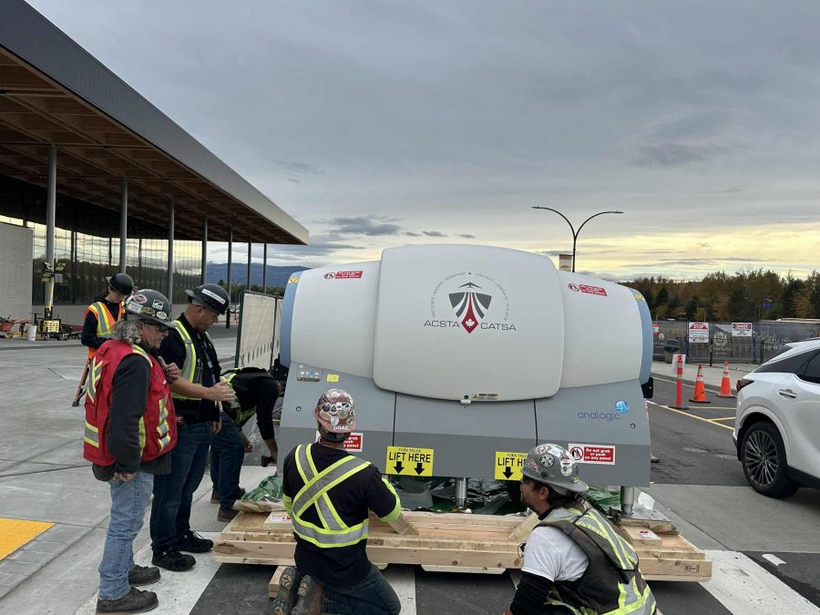<who>Photo credits: Kelowna airport</who>Unloading the new equipment.