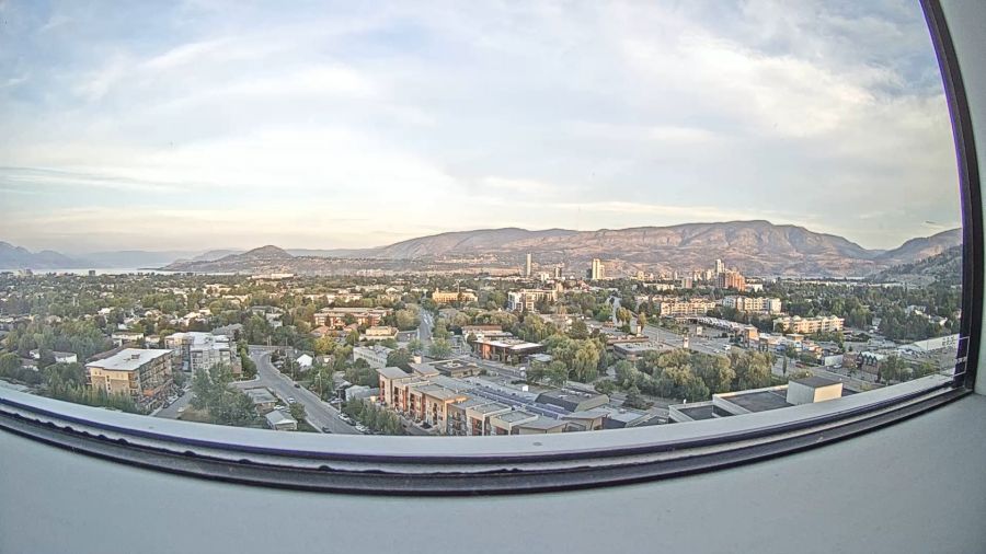 <who> Photo credit: KelownaNow </who> The KelownaNow webcam looking in the direction of the fire early this morning.