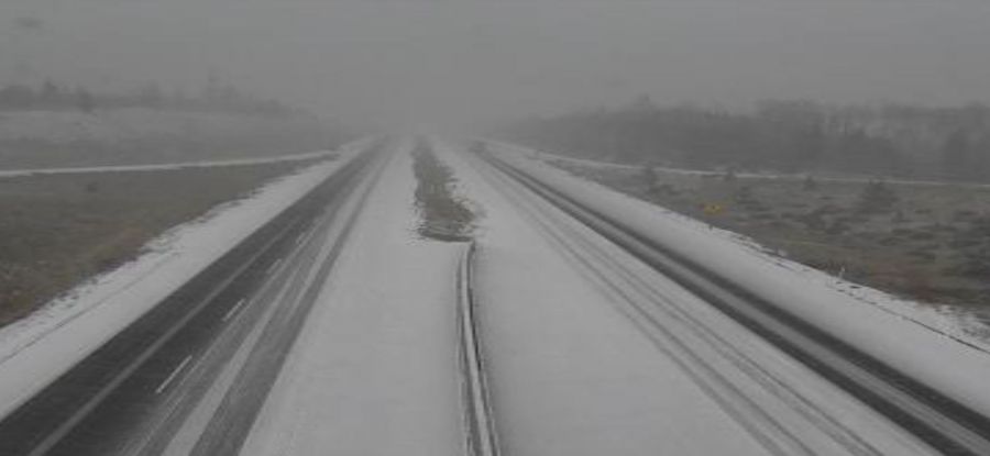 <who>Photo Credit: DriveBC webcam</who>Snow on Hwy 5 between of Kamloops and Merritt around 9:20 am.