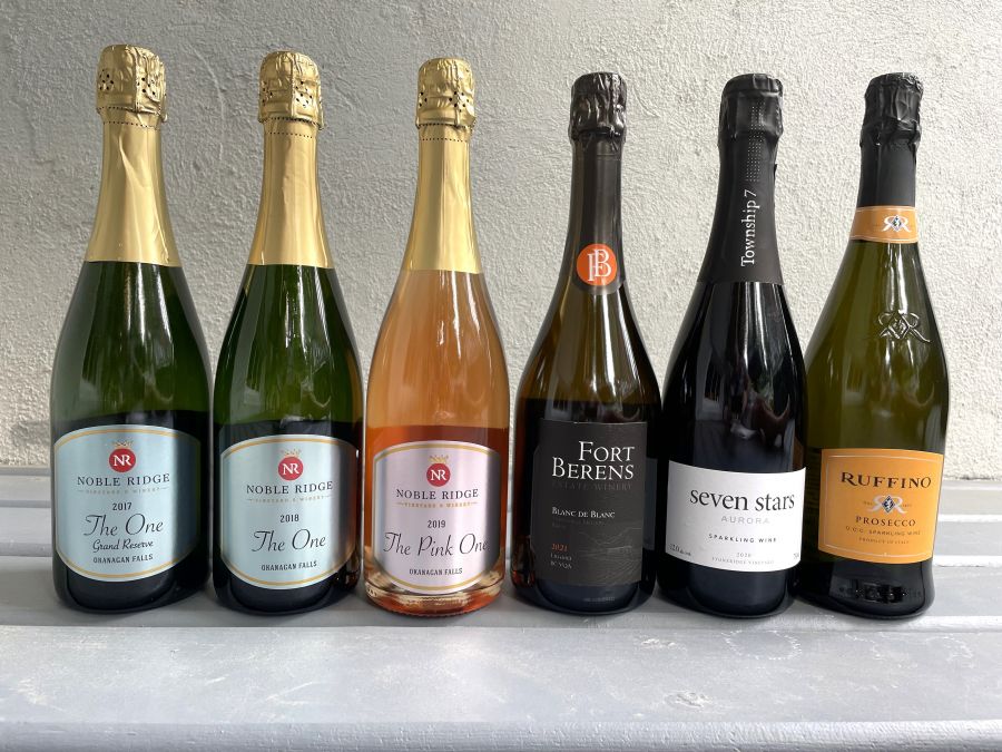 <who>Photo credit: Steve MacNaull/NowMedia Group</who>A half-dozen sparklers you can drink anytime, from left, Noble Ridge 2017 The One Grand Reserve ($50), Noble Ridge 2018 The One ($35), Noble Ridge The Pink One 2018 ($35), Fort Berens 2021 Blanc de Blanc ($35), Township 7 Seven Stars 2020 Aurora Blanc de Noir (wine club exclusive) and Ruffino Prosecco ($23).