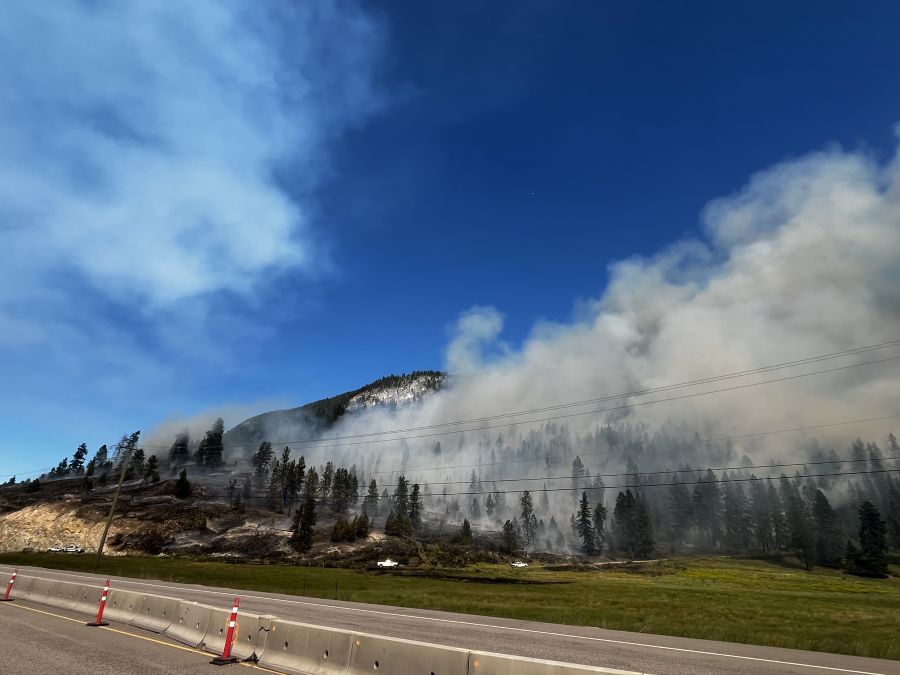 <who>Photo Credit: NowMedia</who>A wildfire burning along Hwy 1 near Chase in late June.