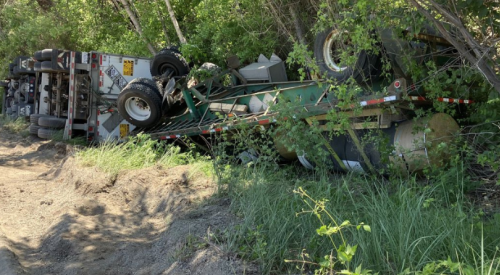 Truck carrying dangerous goods rolls into ditch east of Osoyoos